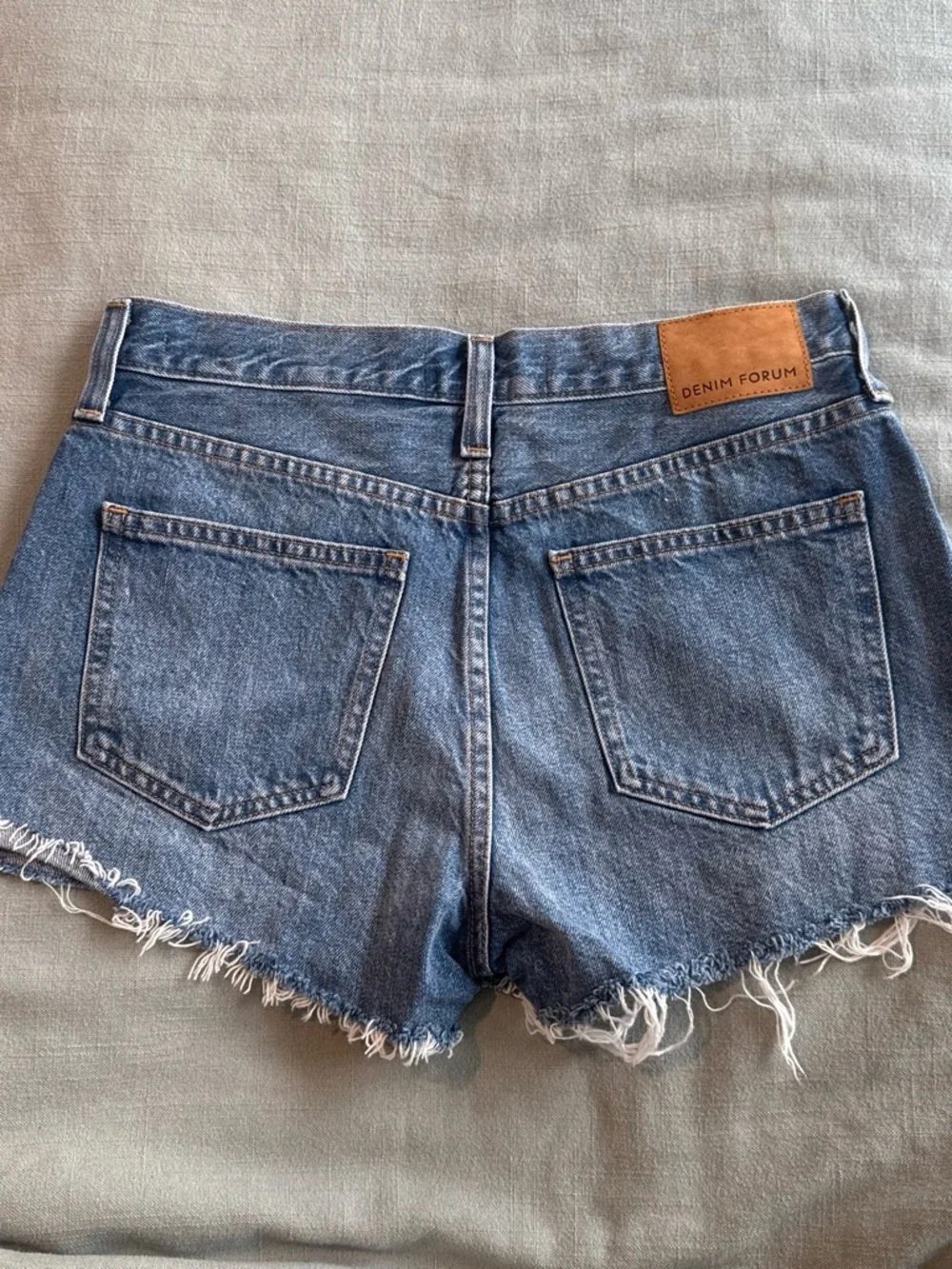 Denim Forum the yoko short.  Distressed Blue High-Rise Frayed Hem Denim Shorts